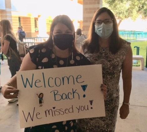 Teachers welcome back Carwise Middle School students.